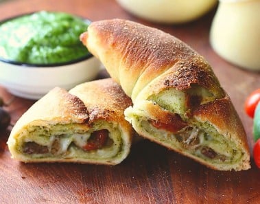 Calzone pizza with pesto, tomatoes, cheese and olives recipe