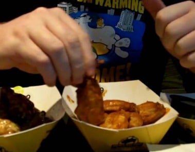 how to eat a chicken wing with one hand.