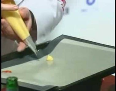 Consommé of Chicken Profiterole of Foie Gras and Truffle by Masterchef Alain Llorca