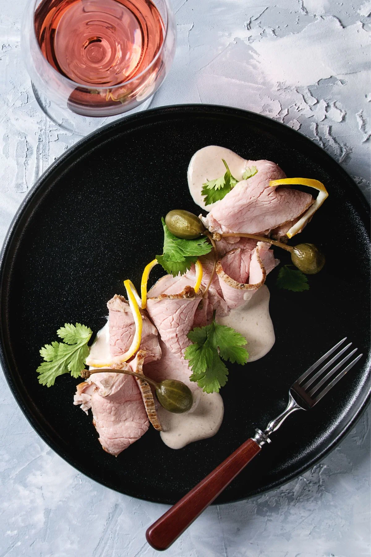 an image of a plate with vitello tonnato recipe.