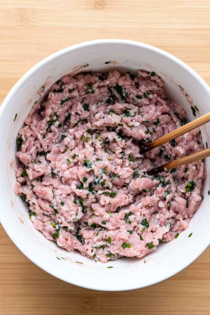 Step 1 of making Pan Fried Pork And Chive Potstickers — Mix the filling