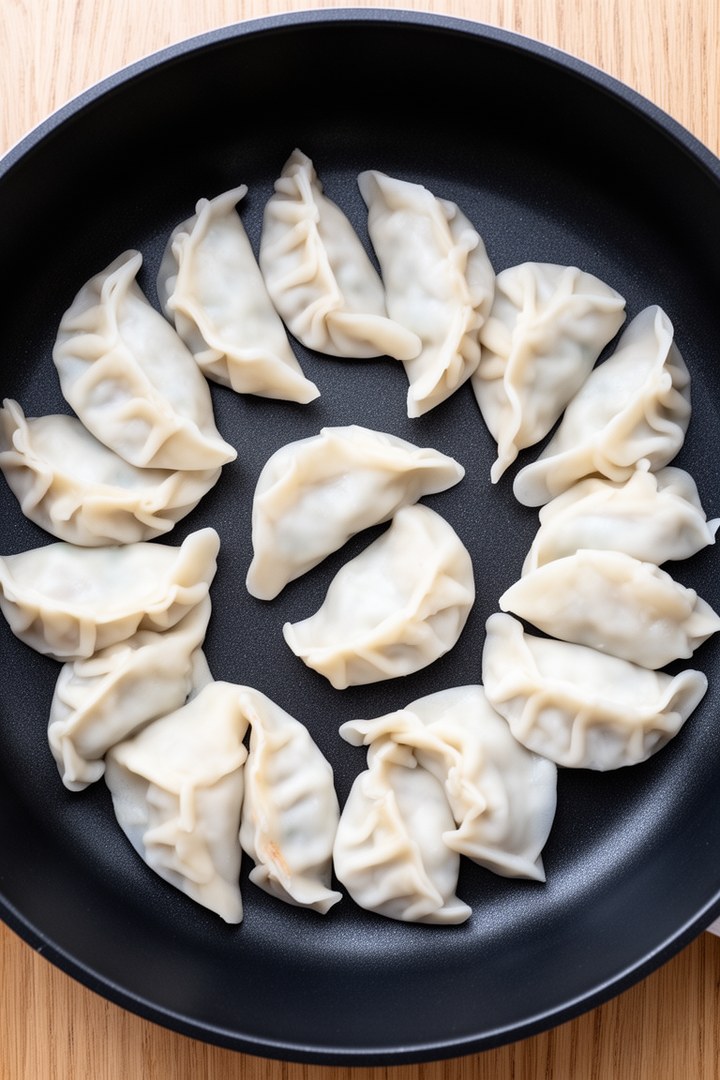 Step 3 of making Pan Fried Pork And Chive Potstickers — Pan-fry bottoms golden