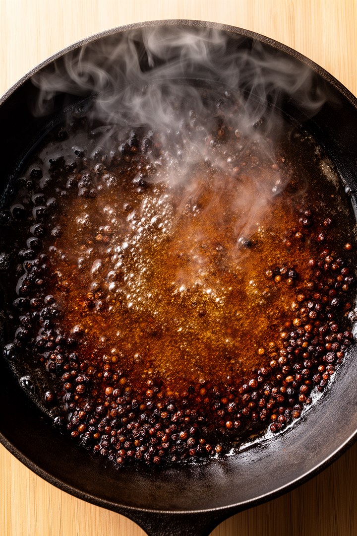 Step 3 of making Steak Au Poivre Recipe — Deglaze with cognac