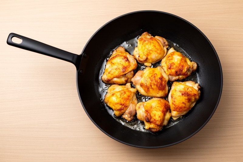 Step 3 of making Sweet Sour Pineapple Chicken — Reduce sauce for 4-5 minutes